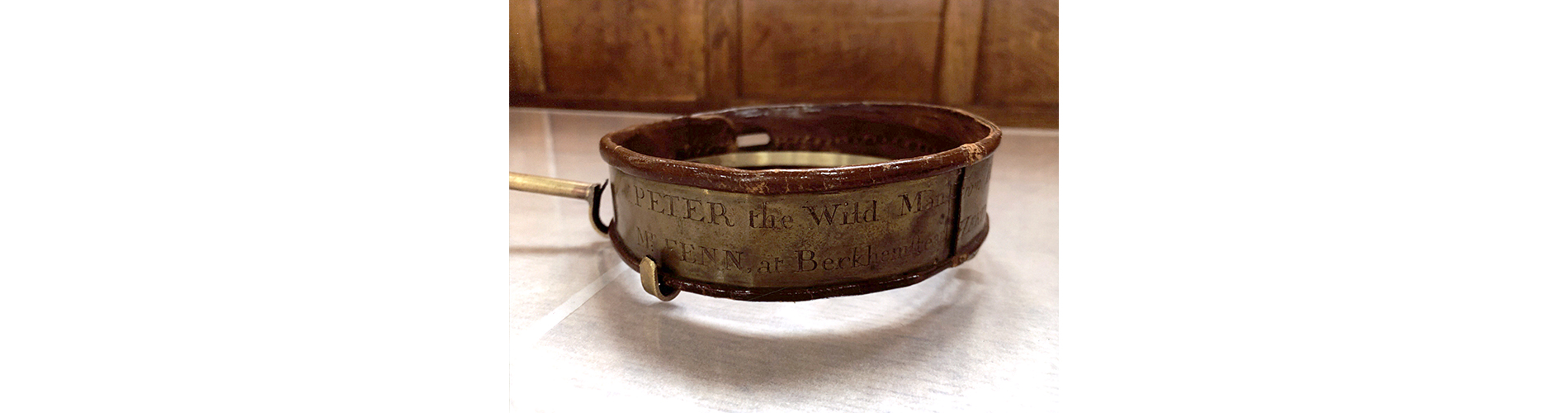 This collar, in the safe keeping of the school is a part of the story of a young boy found in the forests near Hameln, Northern Germany in 1725.
Known as 'Peter the Wild Boy', he was brought to England by King George I and was a curiosity of the court.
He was retired to the country, after interest in him waned and lived out his days with Farmer Fenn in Hertfordshire.
There is a depiction of Peter and his tutor Dr Arbuthnot, in a large painting of King George's court that hangs on the King's staircase at Kensington Palace.
Peter died in 1785.